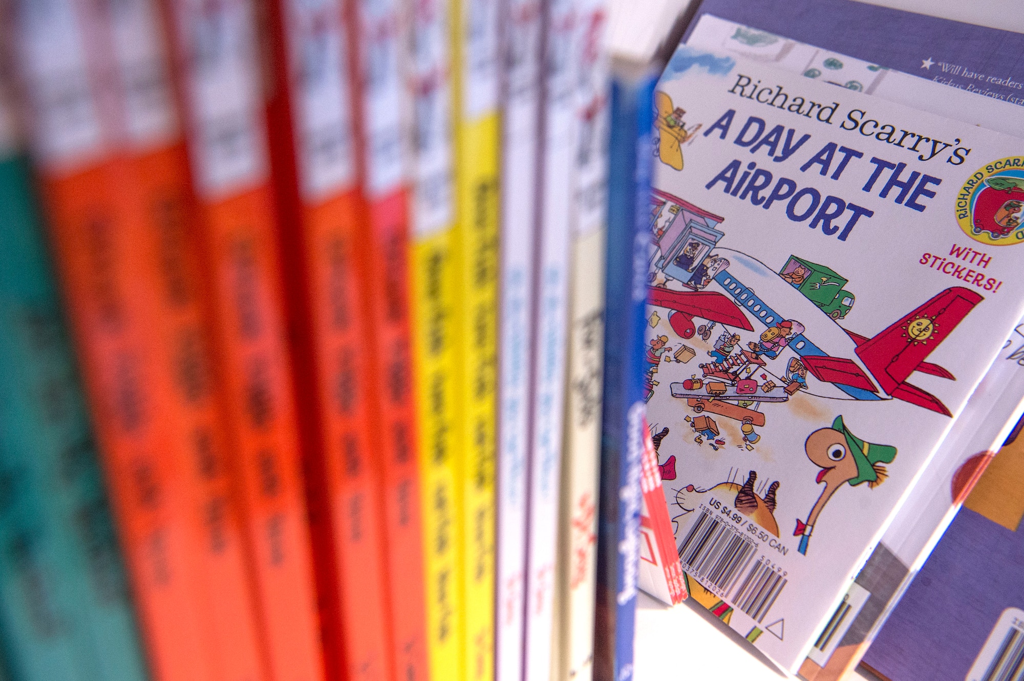 Books are organized on a shelf for service members to select as part of United Service Organizations (USO) Qatar’s reading program Feb. 8, 2019, at Al Udeid Air Base, Qatar. The USO reading program allows service members to record themselves reading books to send back to their children. Program participants can write messages in the books and send them to their children along with the video recording. (U.S. Air Force photo by Tech. Sgt. Christopher Hubenthal)