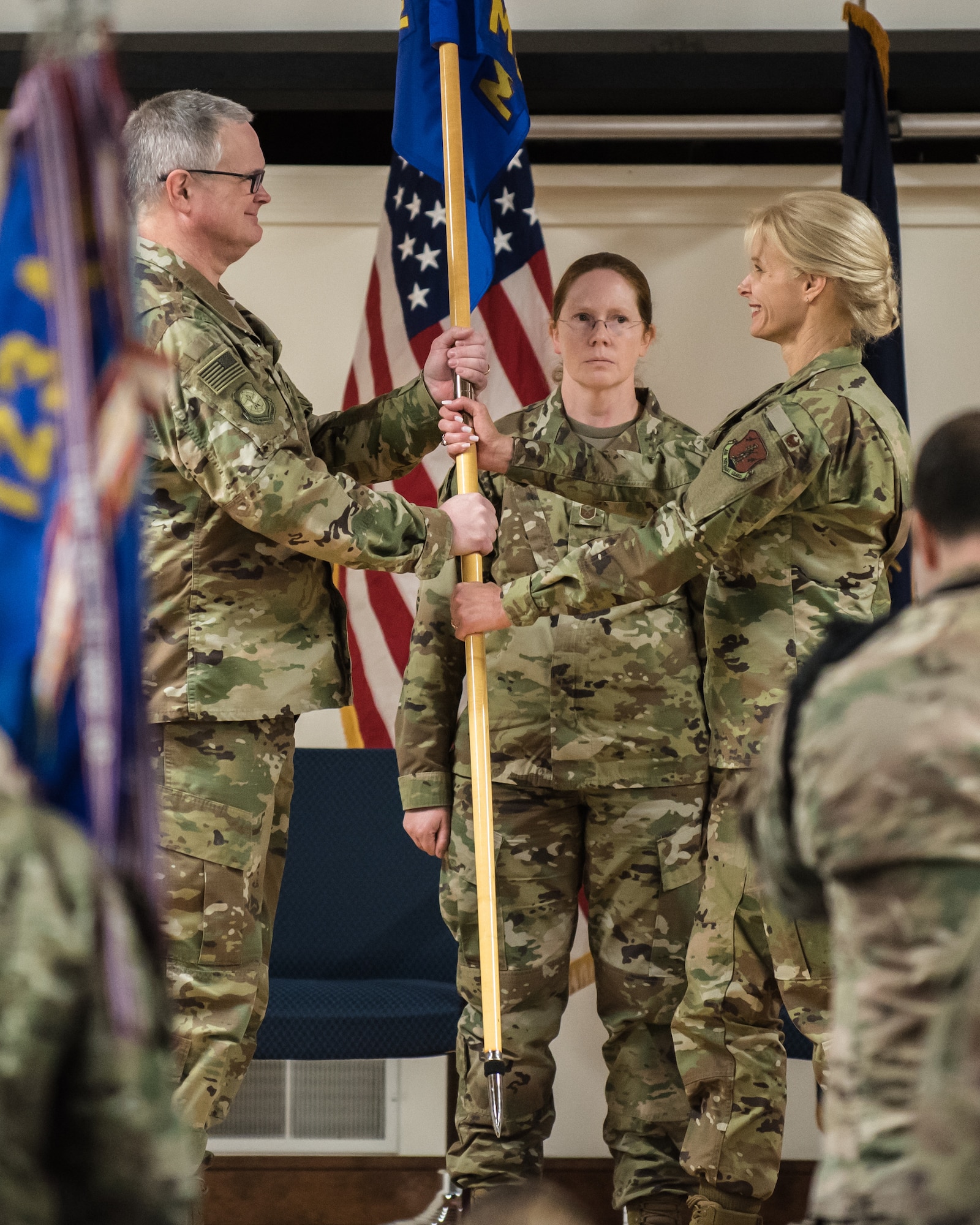 Col. Mary Decker accepts the 123rd Mission Support Group guidon from Col. David Mounkes, commander of the 123rd Airlift Wing, as she assumes command of the group during a ceremony at the Kentucky Air National Guard Base in Louisville, Ky., Jan. 5, 2019. Decker replaces Col. Patrick Pritchard, who has been named vice commander of the 123rd Airlift Wing. (U.S. Air National Guard photo by Dale Greer)