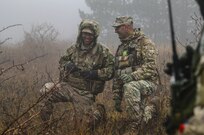 U.S. Army 1st Lt. Russyl Soto (left) and Georgian Army Maj. Bacho Ghakaria(right) observe and control an operation during a Combat Training Center rotation which evaluates the performance of Georgian Army units at Norio Training Area, Georgia, Nov. 13, 2018.