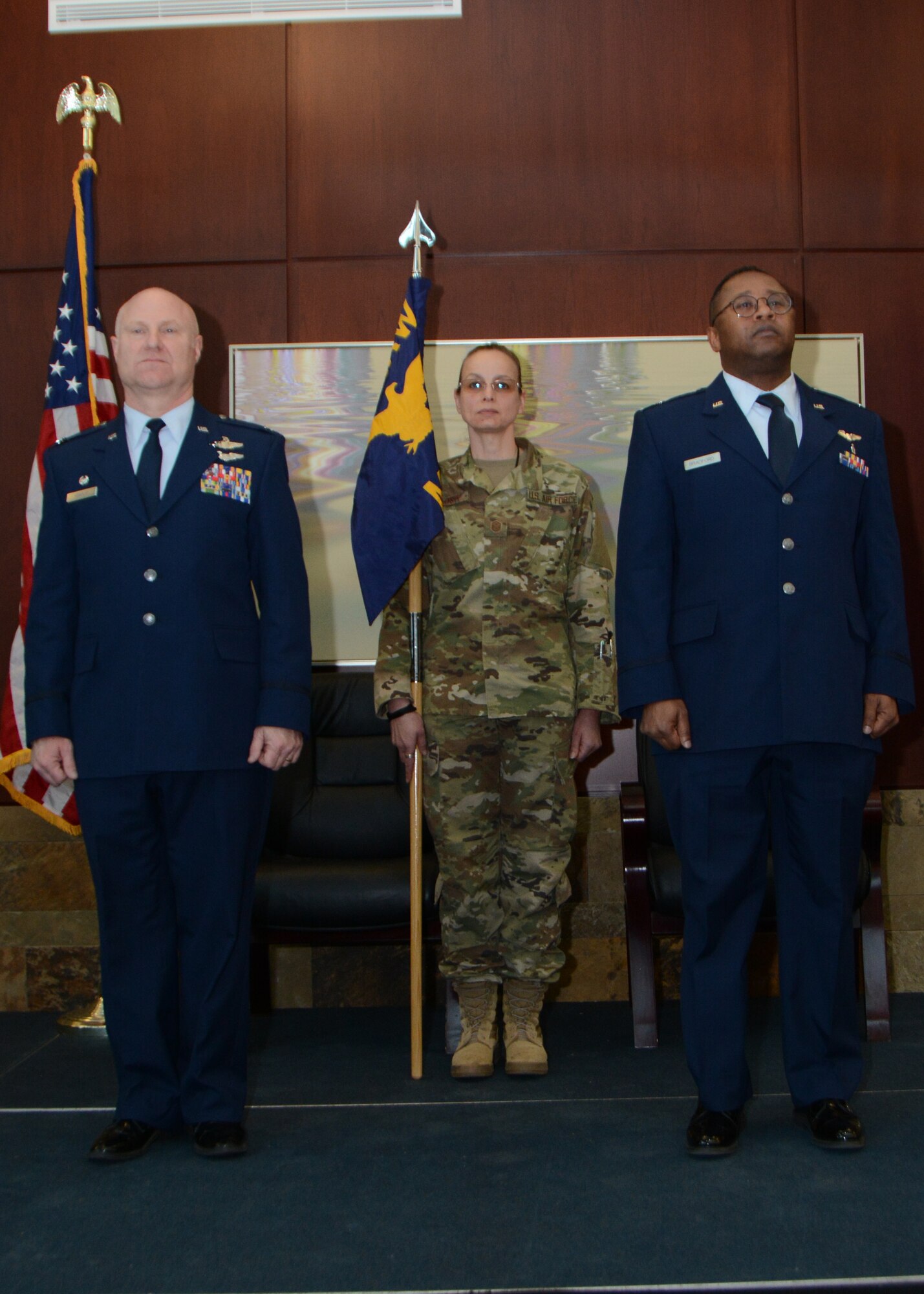 Lt. Col. (Dr.) Alvin Bradford stands ready to accept the guideon from the 507th Air Refueling Wing Commander, Col. Miles Heaslip, during the 507th Medical Squadron assumption of command ceremony at Tinker Air Force Base, Oklahoma, Feb. 9, 2019. Prior to assuming command, Bradford served as the Chief of Aerospace Medicine in the 507th MDS. (U.S. Air Force photo by Master Sgt. Grady Epperly)