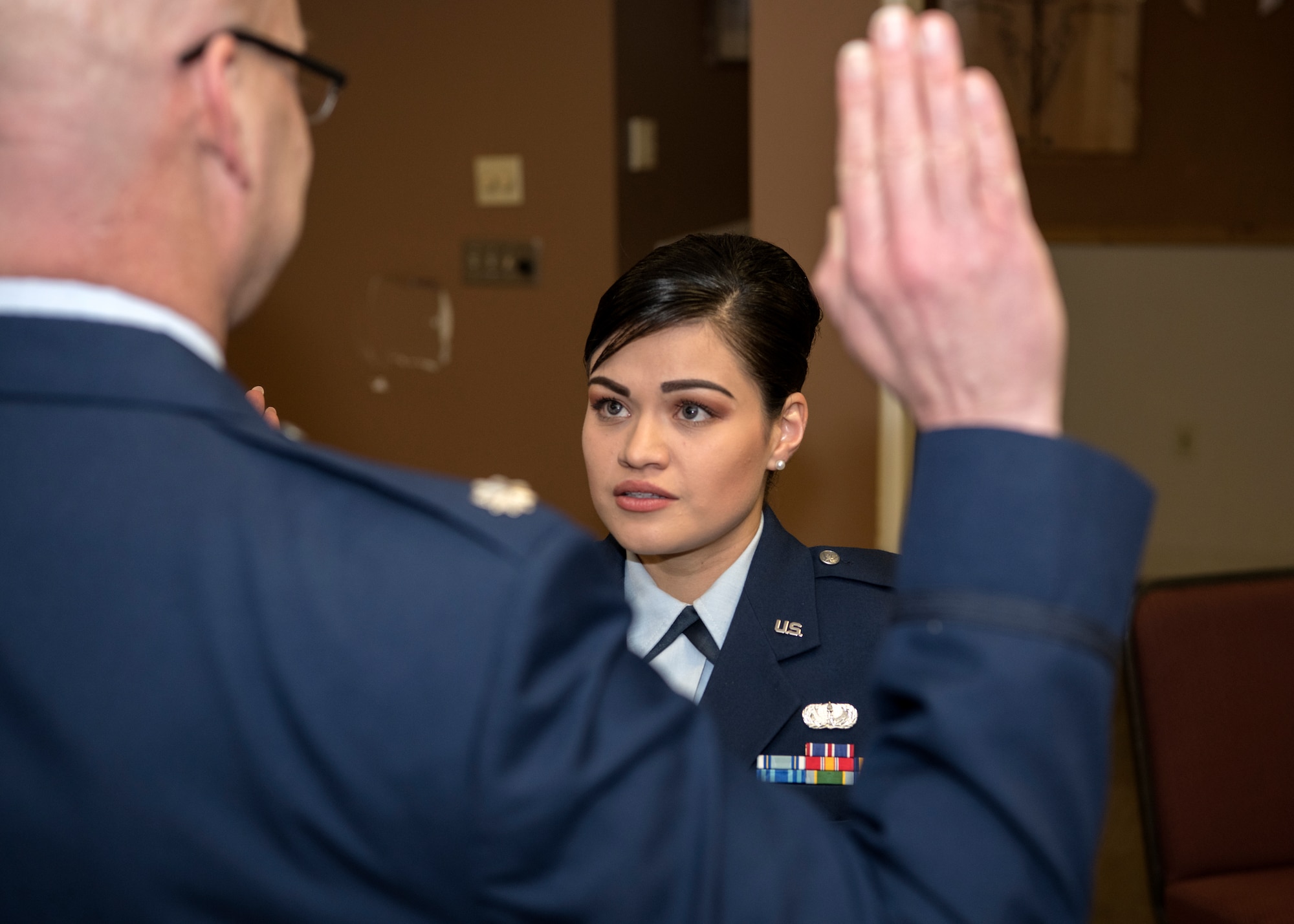 Lieutenant Colonel Mark Guerber, detachment commander for University of Massachusetts in Amherst Reserve Officer Training Corps Detachment 370, commissions 2nd Lt. Nicolle Mathison Feb. 7, 2018, at Barnes Air National Guard Base. Mathison graduated from UMASS ROTC Det 3 as the cadet commander. (U.S. Air National Guard photo by Airman 1st Class Randy Burlingame)