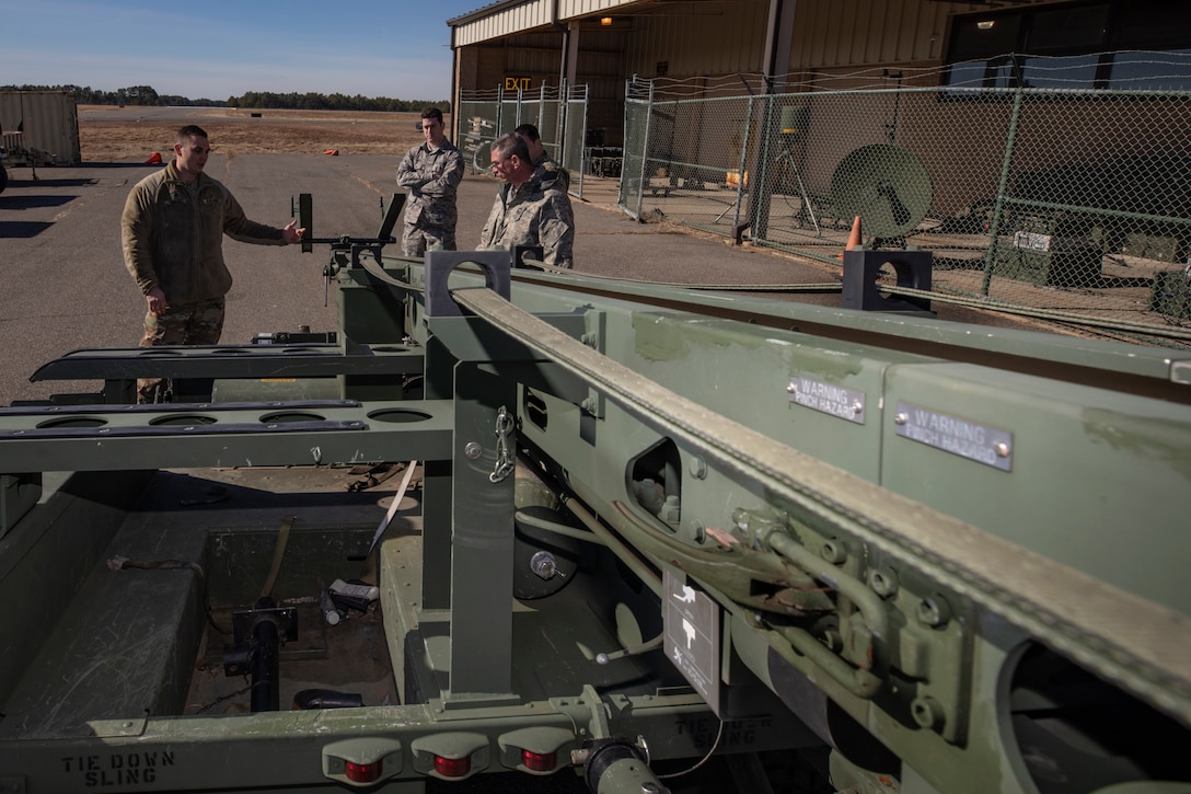U.S. Army Staff Sgt. Matt Hedges, left, briefs Airmen from the 204th Intelligence Squadron and 177th Intelligence Squadron on the capabilities of the RQ-7 Shadow catapult on Joint Base McGuire-Dix-Lakehurst, N.J., Feb. 10, 2019. Hedges is with the New Jersey Army National Guard's 104th Brigade Engineer Battalion.