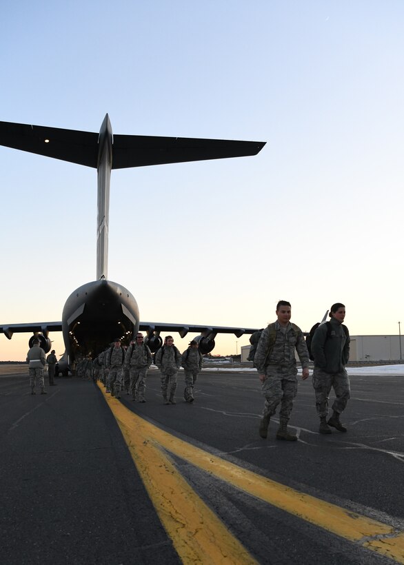 Airmen from the 104th Fighter Wing returned from a temporary duty assignment at Patrick Air Force Base in Florida on a C-17 Globemaster III from the 105th Airlift Wing in Stewart, New York Feb. 8, 2019, at Barnes Air National Guard Base, Massachusetts. Temporary duty assignments like this one provide training for Airmen that prepares them to be more efficient during larger deployments.  (U.S. Air National Guard photos by Airman Sara Kolinski)
