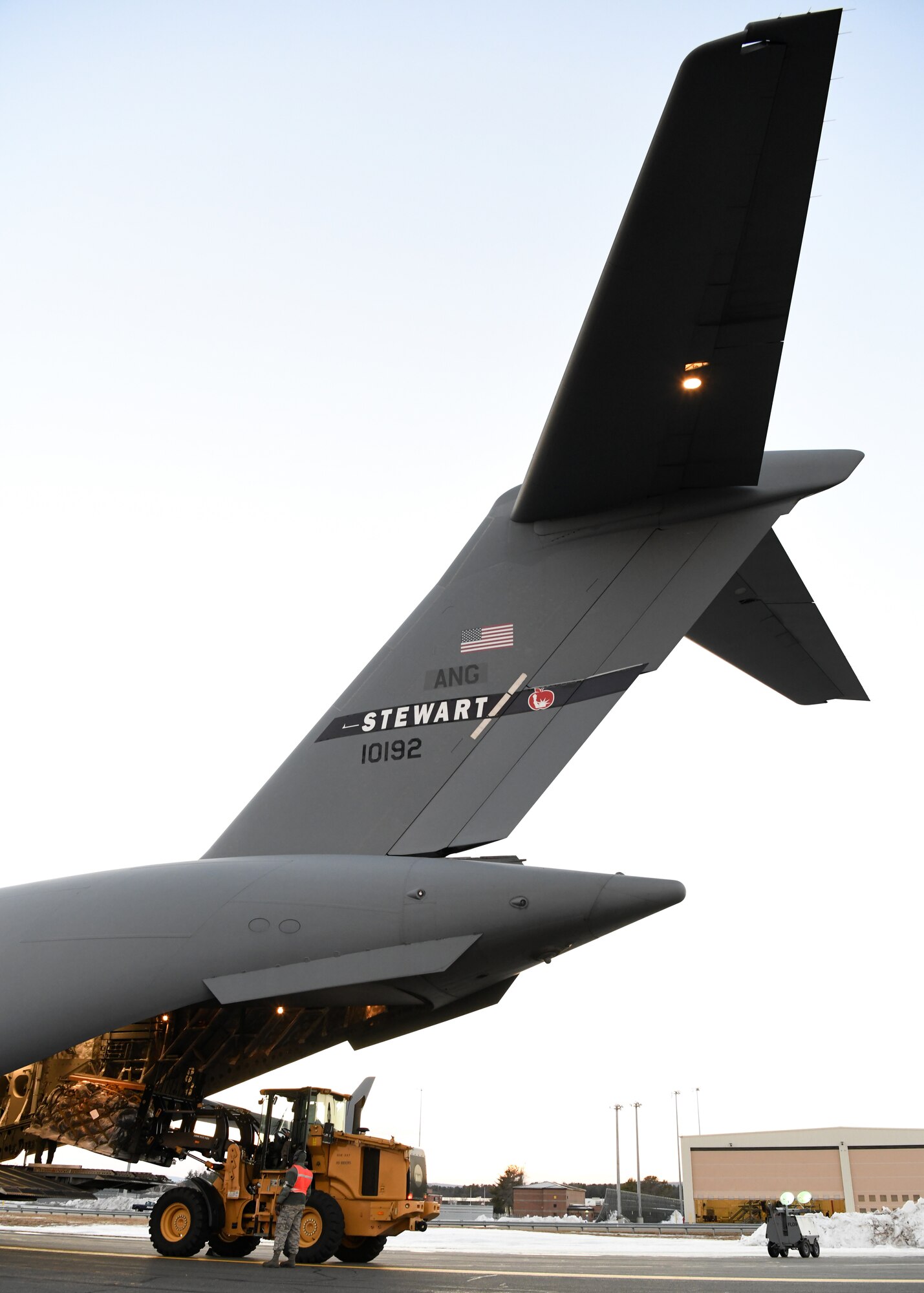 Airmen from the 104th Logistics Readiness Squadron helped unload pallets and equipment from a C-17 Globemaster III from the 105th Airlift Wing in Stewart, New York  Feb. 8, 2019, at Barnes Air National Guard Base, Massachusetts. Airmen from the 104th Fighter Wing were returning from a temporary duty assignment at Patrick Air Force Base in Florida.  (U.S. Air National Guard photos by Airman Sara Kolinski)