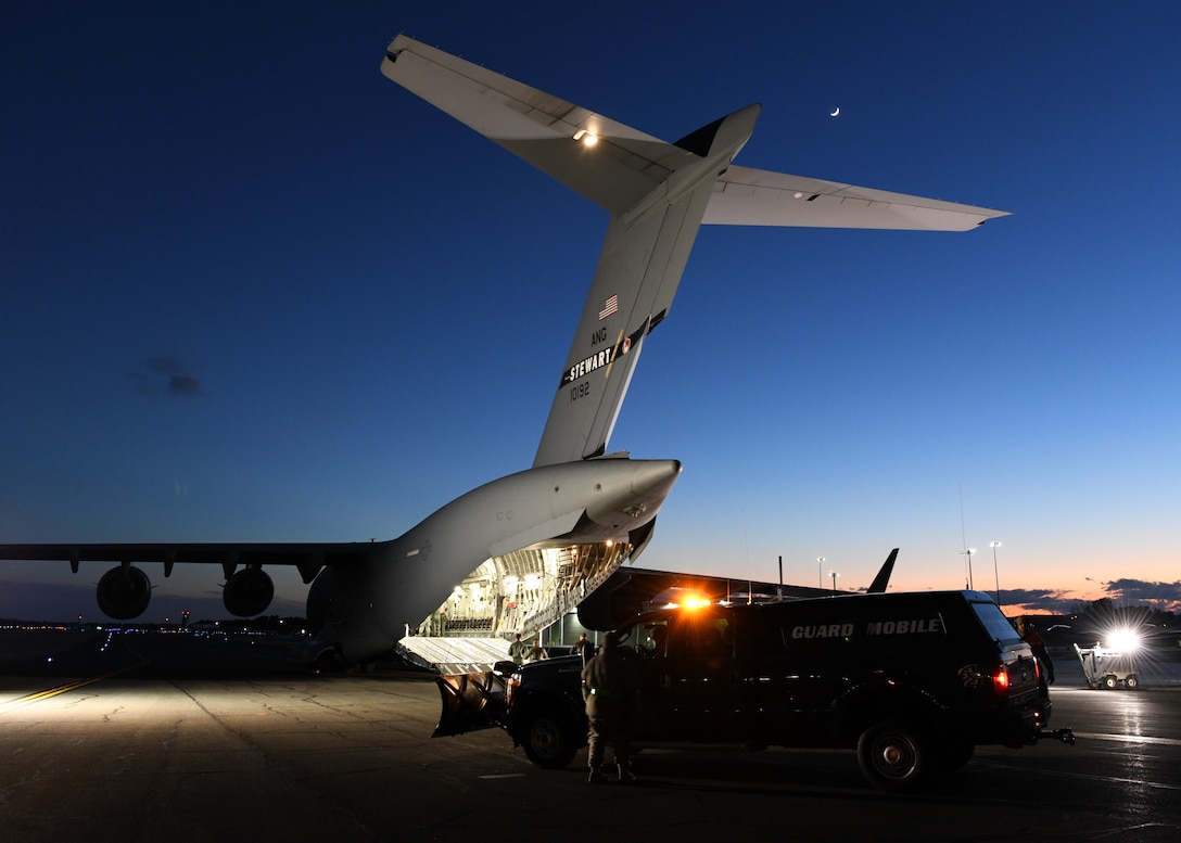 A C-17 Globemaster III from the 105th Airlift Wing in Stewart, New York supports the 104th Fighter Wing Feb. 8, 2019, at Barnes Air National Guard Base, Massachusetts. Airmen form the 104 FW coordinated with the 105 AW crew to safely get Airmen that had been at Patrick Air Force Base, Florida on a temporary duty assignment, back to the 104th.  (U.S. Air National Guard photos by Airman Sara Kolinski)