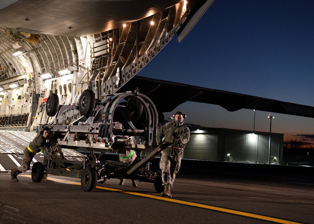 Airmen from the 104th Logistics Readiness Squadron helped unload equipment from a C-17 Globemaster III from the 105th Airlift Wing in Stewart, New York  Feb. 8, 2019, at Barnes Air National Guard Base, Massachusetts. The equipment and 104th Fighter Wing Airmen returned from a temporary duty assignment at Patrick Air Force Base, Florida.  (U.S. Air National Guard photos by Airman Sara Kolinski)
