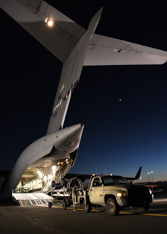 Airmen from the 104th Logistics Readiness Squadron helped unload equipment from a C-17 Globemaster III from the 105th Airlift Wing in Stewart, New York  Feb. 8, 2019, at Barnes Air National Guard Base, Massachusetts. Temporary duty assignments like the one to Patrick Air Force Base in Florida benefit LRS by providing practice for large scale deployments.  (U.S. Air National Guard photos by Airman Sara Kolinski)