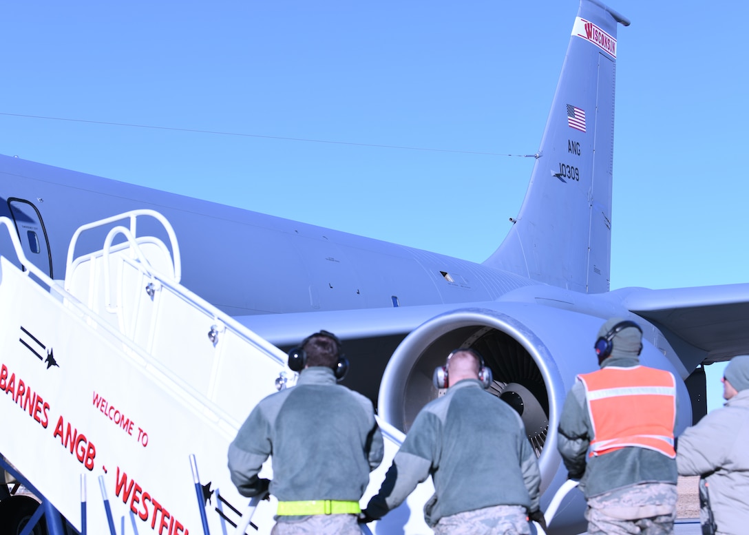 104th Logistics Readiness Squadron vehicle maintainers greet Airmen from the 104th Fighter Wing as they prepare to disembark from a KC-135 Stratotanker from the 128th Air Refueling Wing, Feb. 9, 2019, at Barnes Air National Guard Base, Massachusetts. The Airmen returned from a temporary duty assignment at Patrick Air Force Base where they trained with members of the 180th Fighter Wing. (U.S. Air National Guard photo by Airman 1st Class Randy Burlingame)