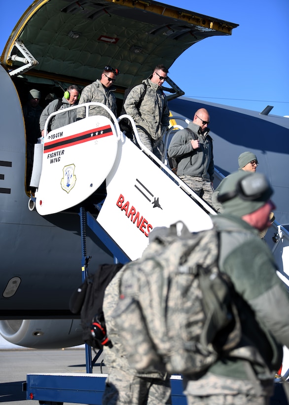 Airmen from the 104th Fighter Wing disembark from a KC-135 Stratotanker from the 128th Air Refueling Wing, Feb. 9, 2019, at Barnes Air National Guard Base, Massachusetts. The Airmen returned from a temporary duty assignment at Patrick Air Force Base where they trained with members of the 180th Fighter Wing. (U.S. Air National Guard photo by Airman 1st Class Randy Burlingame)