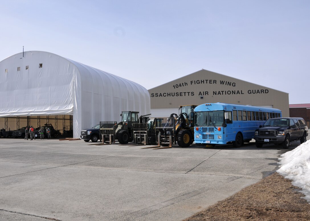 Airmen from the 104th Logistics Readiness Squadron prepare to recieve an incoming C-17 Globemaster III from the 145th Airlift Wing  in Charlotte, North Carolina as they support the 104th Fighter Wing Feb. 10, 2019, at Barnes Air national Guard Base, Massachusetts. the C-17 brought Airmen and equipment from Patrick Air Force Base, Florida back to the 104th Fighter Wing after a two week temporary dury assignment where the Airmen recieved training essential to the success of the mission.   (U.S. Air National Guard Photos by Tech. Sgt. Lindsey Sarah Watson-Kirwin)