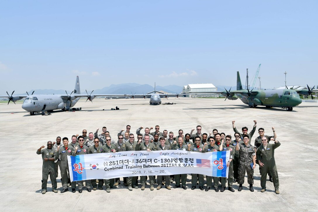 U.S. Airmen assigned to the 36th Tactical Airlift Squadron from Yokota Air Base, Japan, and Republic of Korea airmen with the 251st Airlift Squadron pose for a photo at Gimhae Air Base, ROK, July 2018. (Courtesy photo by Captain Jason Lim)