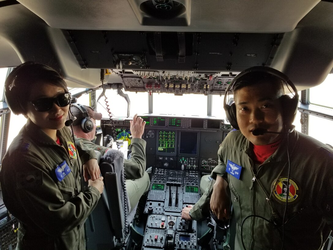 U.S. Airmen and Republic of Korea airmen conduct pre-flight preparations on the C-130J during combined airlift training between the USAF 36th Tactical Airlift Squadron from Yokota Air Base, Japan, and the ROKAF 251st Airlift Squadron at Gimhae Air Base, July 2018. (Courtesy photo by Captain Jason Lim)