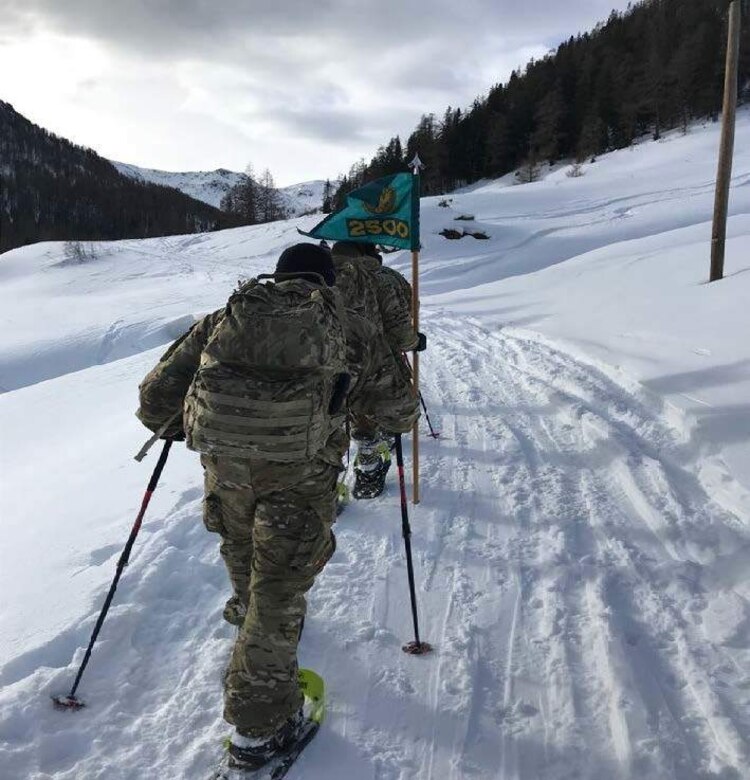 Members of the 2500th Digital Liason Detachment climb Refugio peak near Wiessenbach, Italy, Jan. 12 during the unit's three-day battle assembly, Jan 11-13. The unit climbed to the peak with the 6th Alpini Regiment of the Italian army.
