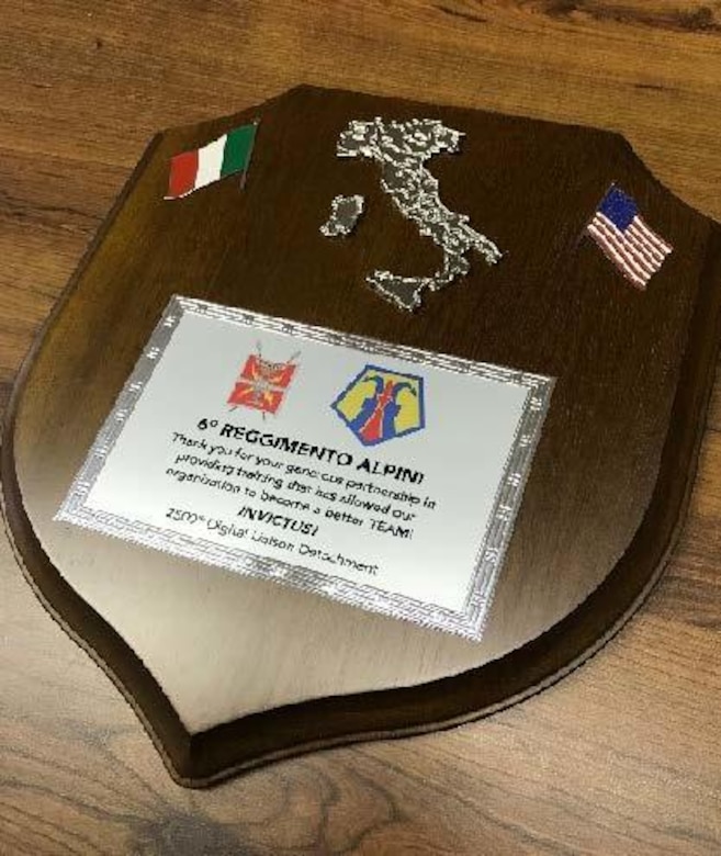 The 6th Alpini Regiment of the Italian army presented a plaque to the 2500th Digital Liason Detachment, Jan. 13 at the conclusion of the Detachment's three-day battle assembly, Jan. 11-13. The units climbed to Refuio peak near Wiessenbach, Italy.