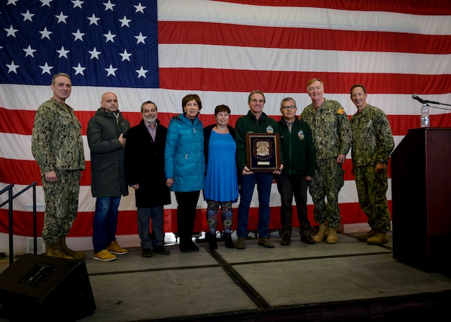 Adm. James G. Foggo III, commander, U.S. Naval Forces Europe-Africa and Allied Joint Forces Command Naples, Italy, poses for a photo with the Naval Support Activity (NSA) Naples safety team after presenting Capt. Todd Abrahamson, commanding officer of NSA Naples, with the 2018 Chief of Naval Operations Shore Safety Award, recognizing the command’s outstanding achievement in safety and occupational health during an all-hands call Dec. 14, 2018.