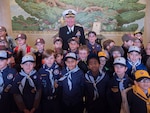 Adm. James Foggo III, commander, U.S. Naval Forces Europe-Africa, poses for a photo with American and French Boy and Girl Scouts during a ceremony at Suresnes American Cemetery celebrating Armistice and Veterans Day Nov. 11, 2017.