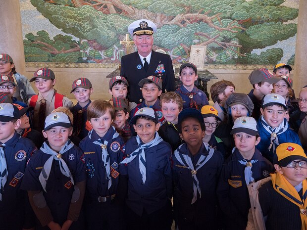 Adm. James Foggo III, commander, U.S. Naval Forces Europe-Africa, poses for a photo with American and French Boy and Girl Scouts during a ceremony at Suresnes American Cemetery celebrating Armistice and Veterans Day Nov. 11, 2017.