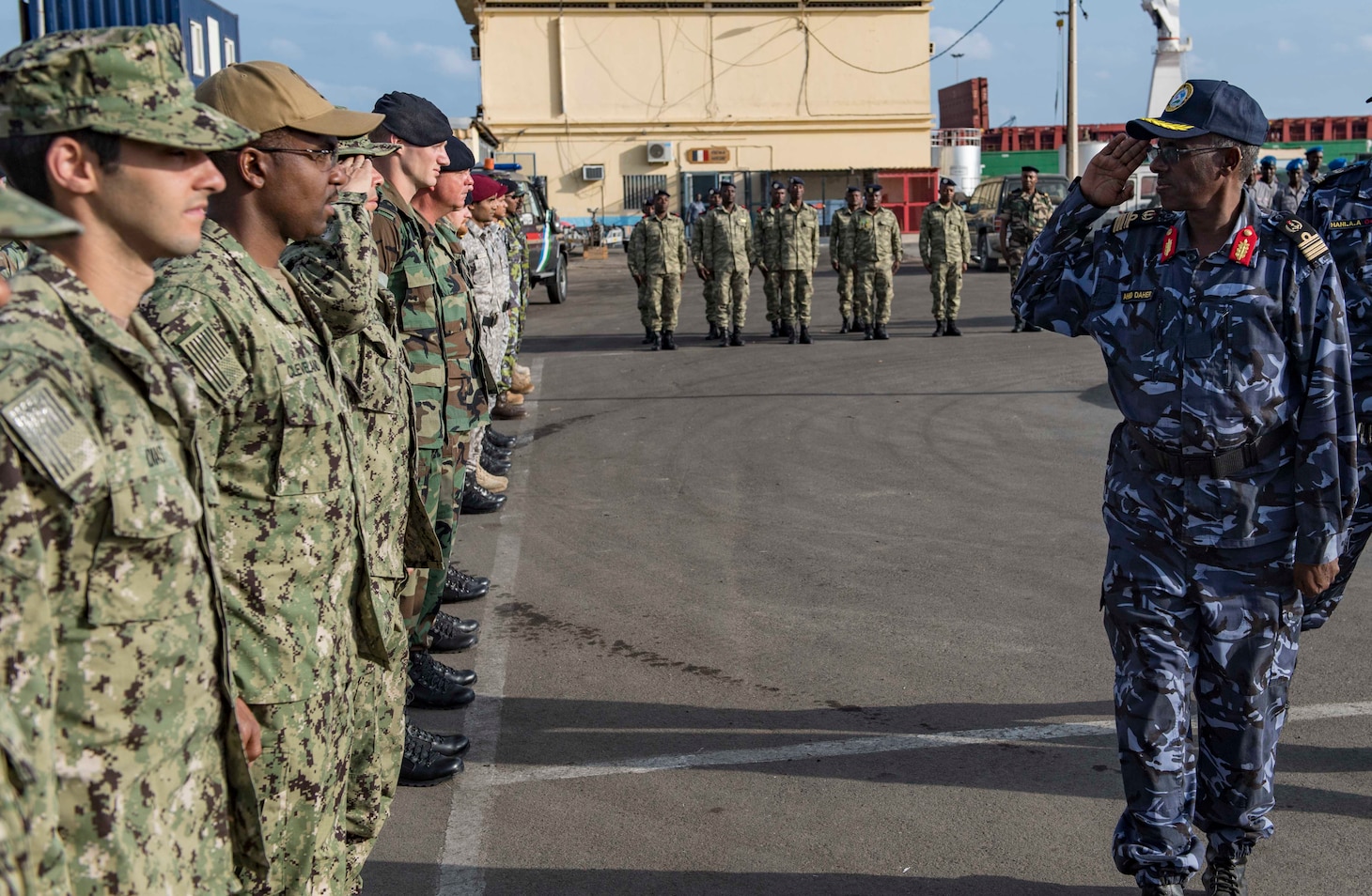 Sailors from the U.S., Indian, Comorian, Kenyan, Djiboutian and Somali navies along with U.S. Coast Guard sailors and Royal Netherlands Marines gather for the closing ceremony of exercise Cutlass Express 2019 in Djibouti, Feb. 6, 2019.