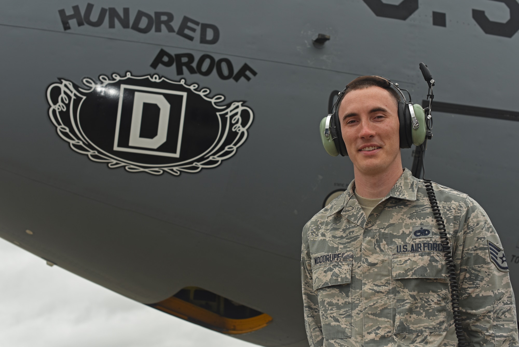 U.S. Air Force Staff Sgt. Trevor Woodruff, 100th Aircraft Maintenance Squadron flying crew chief and instrument and flight controls systems craftsman, poses for a photo with the 100th Air Refueling Wing KC-135 Stratotanker “Hundred Proof” at RAF Mildenhall, England, Feb. 8, 2019. Flying and Dedicated crew chiefs supervise pre- and post-flight actions, conduct inspections, take care of delayed and pilot-reported discrepancies and perform routine maintenance. (U.S. Air Force photo by Airman 1st Class Brandon Esau)