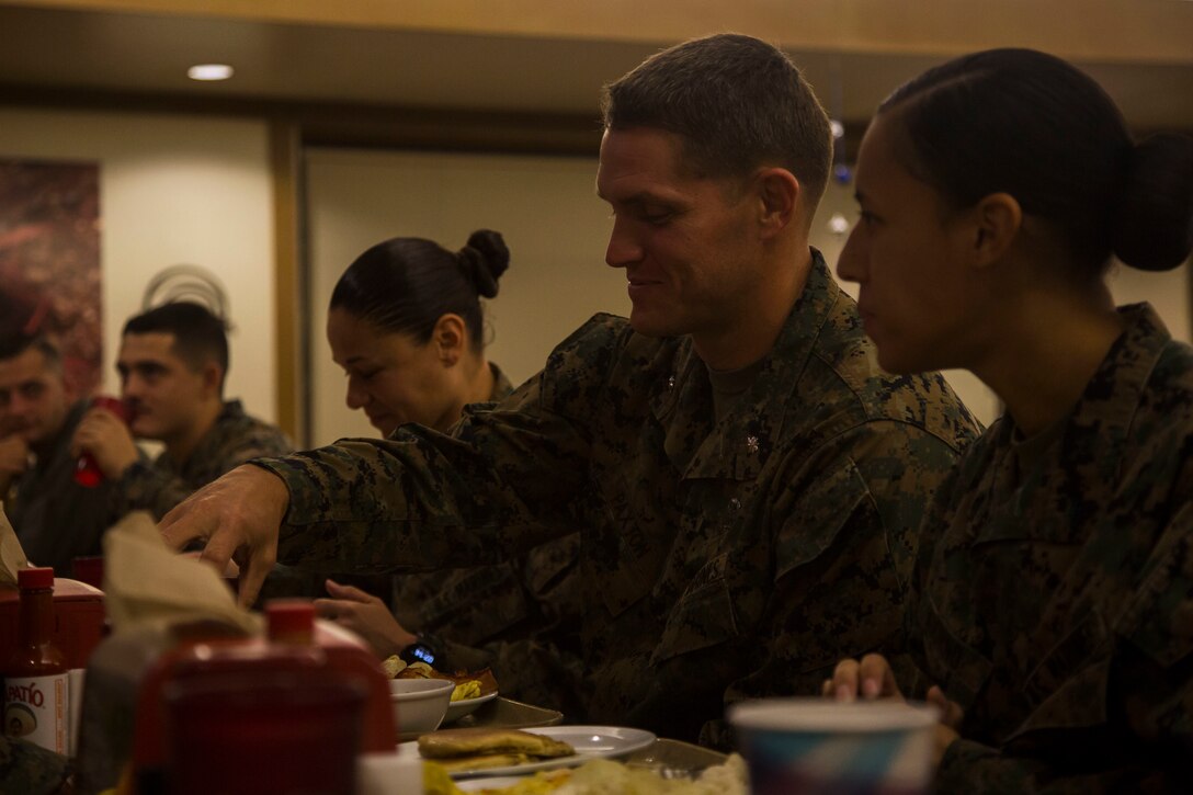 U.S. Marines assigned to Headquarters and Headquarters Squadron (H&HS) meet at the Marine Corps Air Station Yuma Mess Hall to have breakfast with Lt. Col. James C. Paxton, the commanding officer of H&HS, December 21, 2018. The purpose of the breakfast was to discuss holiday plans and  provide some of the Marines with the opportunity to sit down and talk with their commanding officer. (U.S. Marine Corps photo by Cpl. Isaac D. Martinez)