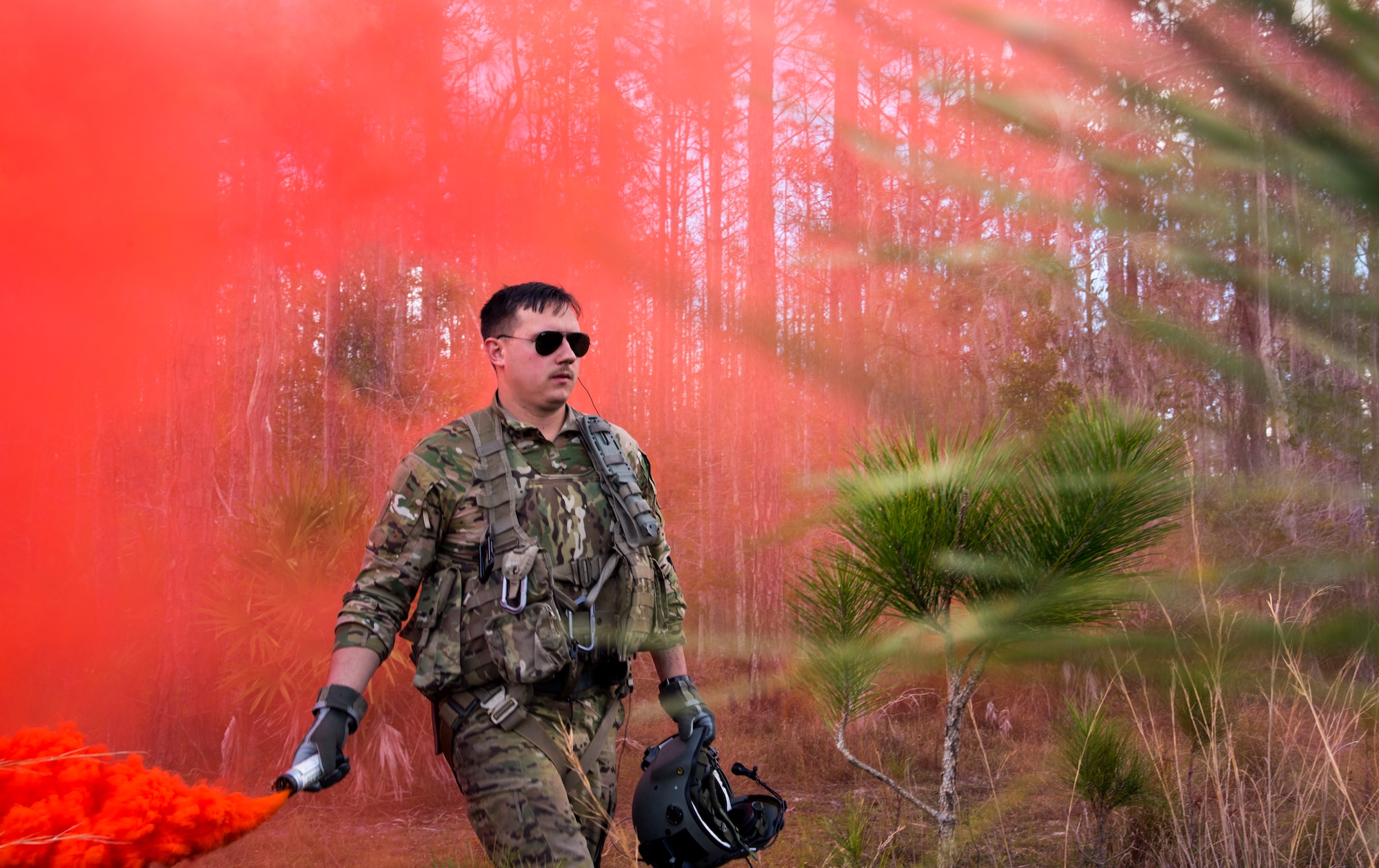 U.S. Army 1st Lt. Anthony Minissale, a 2-10 Assault Helicopter Battalion UH-60 Black Hawk pilot from Fort Drum, New York, uses a signal flare during an Emerald Warrior 2019 search and rescue training exercise at Avon Park, Florida, Jan. 22, 2019.