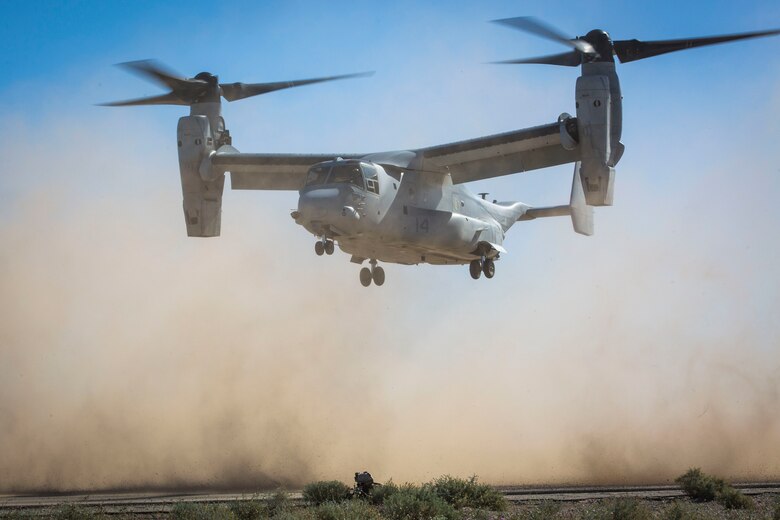 A U.S. Marine assigned to Marine Wing Support Squadron 371 (MWSS-371) sets up security as a MV-22B Osprey aircraft lands at AUX II, one of the training ranges that belongs to Marine Corps Air Station (MCAS) Yuma, Ariz., Jan. 22, 2019. During this portion of the training exercise, the bulk fuels specialists of MWSS-371 practiced setting up security for an MV-22B Osprey landing at AUX II. The MV-22B is a tiltrotor aircraft with both vertical takoff and landing (VTOL), and short takeoff and landing capabilities (STOL) and is the primary assault support aircraft for the U.S. Marine Corps. MCAS Yuma is a prime location to conduct military training with its variety of different training range; both foreign military units and all branches of the U.S. military that visit the air station utilize the ranges throughout the year. (U.S. Marine Corps photo by Cpl. Isaac D. Martinez)