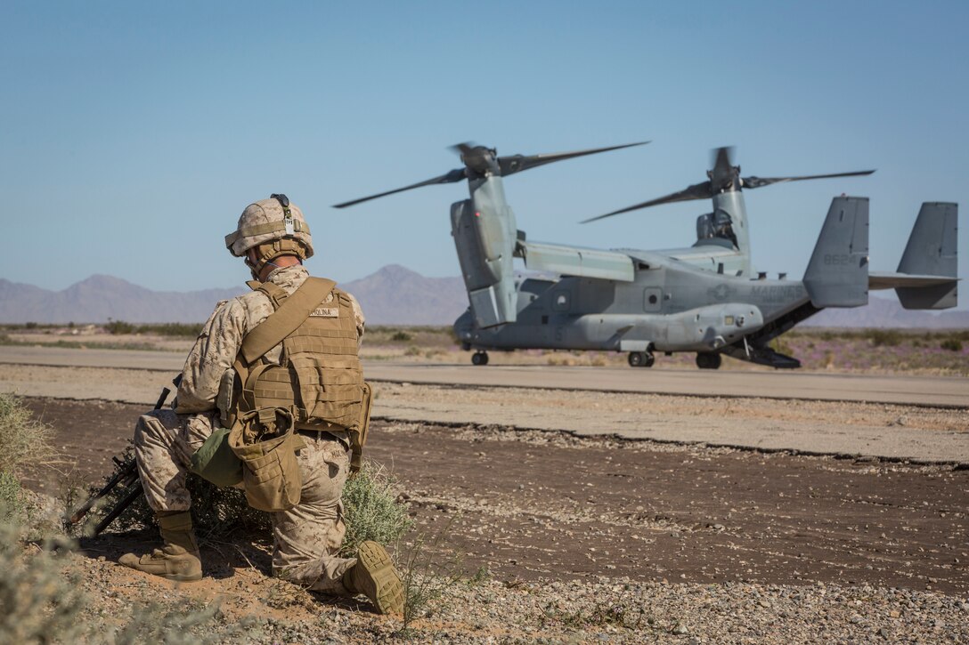 A U.S. Marine assigned to Marine Wing Support Squadron 371 (MWSS-371) provides security as a MV-22B Osprey sits on the landing strip at AUX II, one of the training ranges that belongs to Marine Corps Air Station Yuma, Ariz., Jan. 22, 2019. During this portion of the training exercise, the bulk fuels specialists of MWSS-371 practiced setting up security for an MV-22B Osprey landing at AUX II.