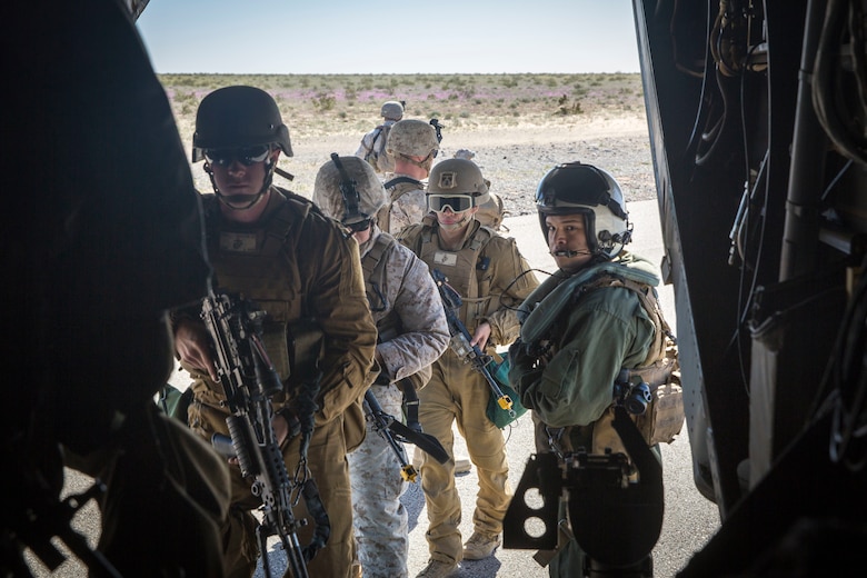 U.S. Marines assigned to Marine Wing Support Squadron 371 (MWSS-371) board a MV-22B Osprey at AUX II, one of the training ranges that belongs to Marine Corps Air Station Yuma, Ariz., Jan. 22, 2019. The bulk fuels specialists needed trasportation to Forward Armored Refueling Point -  LZ Star in order to set up light-weight camouflage screen systems (LCSS). The MV-22B is a tiltrotor aircraft with both vertical takoff and landing (VTOL), and short takeoff and landing capabilities (STOL) and is the primary assault support aircraft for the U.S. Marine Corps. MCAS Yuma is a prime location to conduct military training with its variety of different training range; both foreign military units and all branches of the U.S. military that visit the air station utilize the ranges throughout the year. (U.S. Marine Corps photo by Cpl. Isaac D. Martinez)