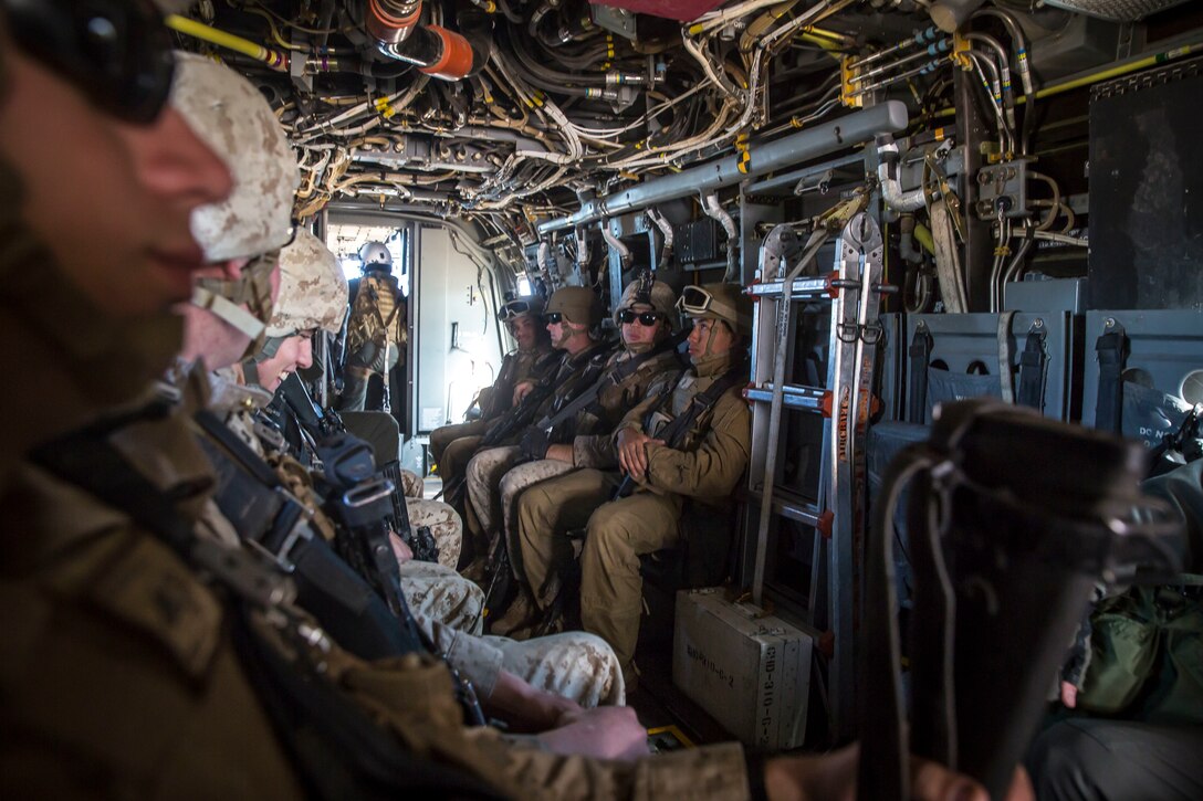 U.S. Marines assigned to Marine Wing Support Squadron 371 (MWSS-371) fly toward Forward Armored Refueling Point (FARP) - LZ Star in a MV-22B Osprey, Jan. 22, 2019. The bulk fuels specialists needed trasportation to FARP -  LZ Star in order to set up light-weight camouflage screen systems (LCSS). The MV-22B is a tiltrotor aircraft with both vertical takoff and landing (VTOL), and short takeoff and landing capabilities (STOL) and is the primary assault support aircraft for the U.S. Marine Corps. MCAS Yuma is a prime location to conduct military training with its variety of different training range; both foreign military units and all branches of the U.S. military that visit the air station utilize the ranges throughout the year. (U.S. Marine Corps photo by Cpl. Isaac D. Martinez)