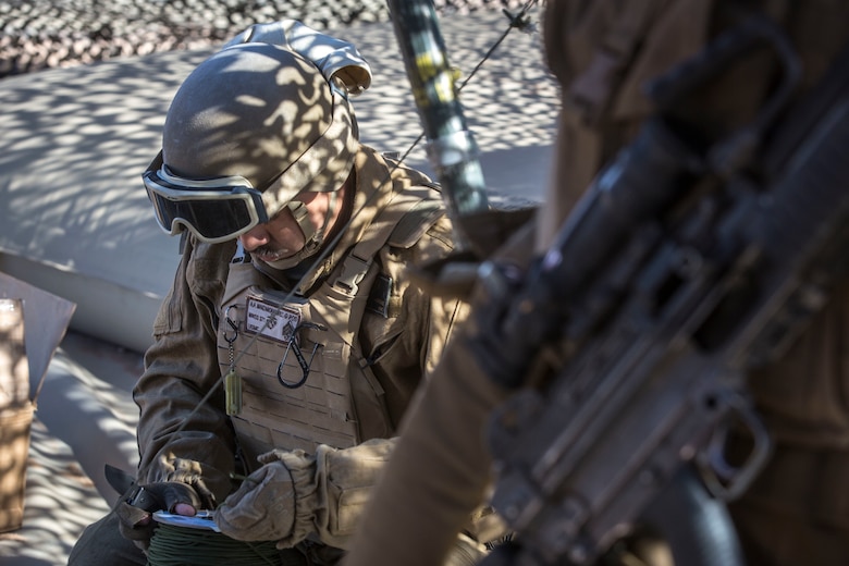 U.S. Marine Corps Sgt. Angel Manzanoramirez, a bulk fuels specialist assigned to Marine Wing Support Squadron 371 (MWSS-371), helps set up a light-weight camouflage screen system (LCSS) at Forward Armored Refueling Point -  LZ Star, Jan. 22, 2019. During this portion of their training exercise, the bulk fuels specialists practiced working together to put together a camouflaged camp at FARP - LZ Star. MCAS Yuma is a prime location to conduct military training with its variety of different training range; both foreign military units and all branches of the U.S. military that visit the air station utilize the ranges throughout the year. (U.S. Marine Corps photo by Cpl. Isaac D. Martinez)
