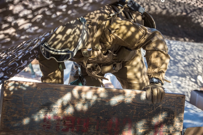 A U.S. Marine assigned to Marine Wing Support Squadron 371 (MWSS-371), helps set up a light-weight camouflage screen system (LCSS) at Forward Armored Refueling Point -  LZ Star, Jan. 22, 2019. During this portion of their training exercise, the bulk fuels specialists practiced working together to put together a camouflaged camp at FARP - LZ Star. MCAS Yuma is a prime location to conduct military training with its variety of different training range; both foreign military units and all branches of the U.S. military that visit the air station utilize the ranges throughout the year. (U.S. Marine Corps photo by Cpl. Isaac D. Martinez)
