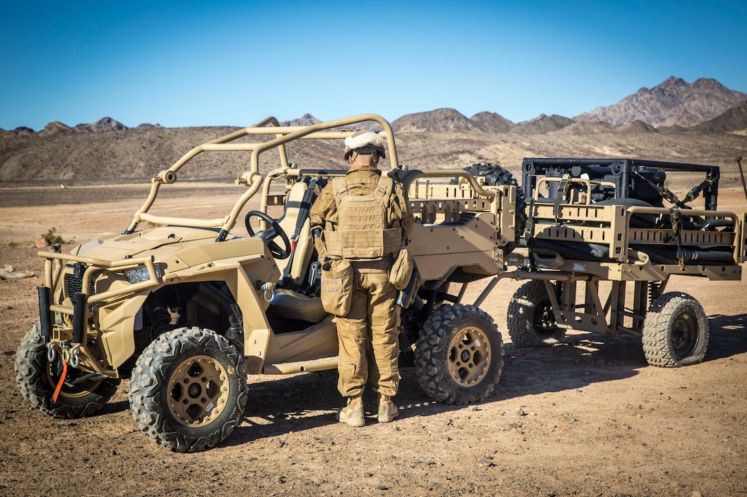U.S. Marine Corps Sgt. Angel Manzanoramirez, a bulk fuels specialist assigned to Marine Wing Support Squadron 371 (MWSS-371), grabs a radio from a Polaris MRZR all-terrain vehicle at Forward Armored Refueling Point -  LZ Star, Jan. 22, 2019. During this portion of their training exercise, the bulk fuels specialists practiced working together to put together a camouflaged camp at FARP - LZ Star. Equipped with a turbo diesel engine and the ability to carry a payload of 1,000 lbs, the MRZR is a highly mobile vehicle that can handle supply transport missions, rapid personnel deployment, and more. MCAS Yuma is a prime location to conduct military training with its variety of different training range; both foreign military units and all branches of the U.S. military that visit the air station utilize the ranges throughout the year. (U.S. Marine Corps photo by Cpl. Isaac D. Martinez)