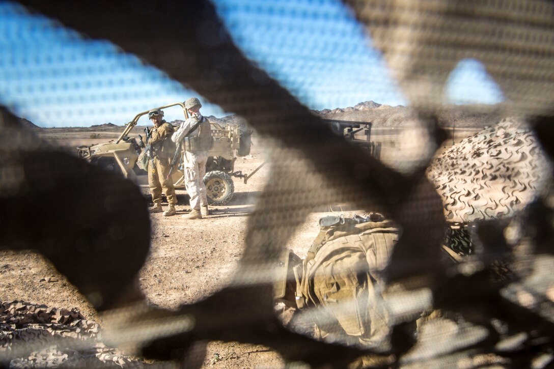 U.S. Marine Corps Sgt. Brandon Hunt, a bulk fuels specialist assigned to Marine Wing Support Squadron 371 (MWSS-371), updates U.S. Marine Corps Sgt. Angel Manzanoramirez on the status of setting up the light-weight camouflage screen system (LCSS) at Forward Armored Refueling Point -  LZ Star, Jan. 22, 2019. During this portion of their training exercise, the bulk fuels specialists practiced working together to put together a camouflaged camp at FARP - LZ Star. Equipped with a turbo diesel engine and the ability to carry a payload of 1,000 lbs, the MRZR is a highly mobile vehicle that can handle supply transport missions, rapid personnel deployment, and more. MCAS Yuma is a prime location to conduct military training with its variety of different training range; both foreign military units and all branches of the U.S. military that visit the air station utilize the ranges throughout the year.