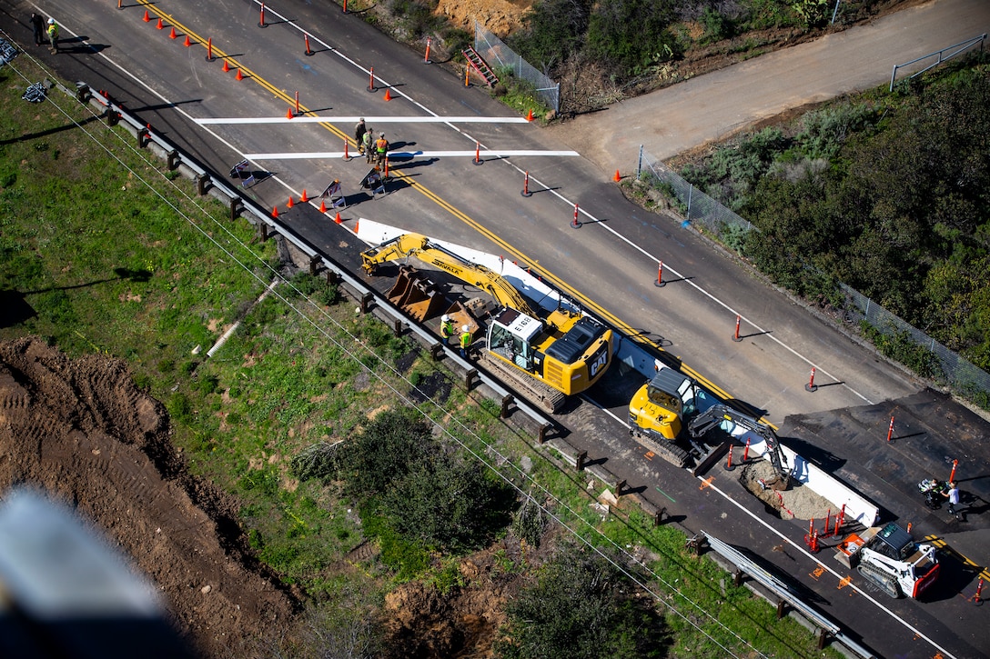 An aerial view of construction and two-way traffic at the Carnes Road sinkhole site at Marine Corps Base Camp Pendleton, California, Feb. 8, 2019. The sinkhole developed in the road earlier in the week after heavy rainfall struck Camp Pendleton. (U.S. Marine Corps photo by Cpl. Dylan Chagnon)