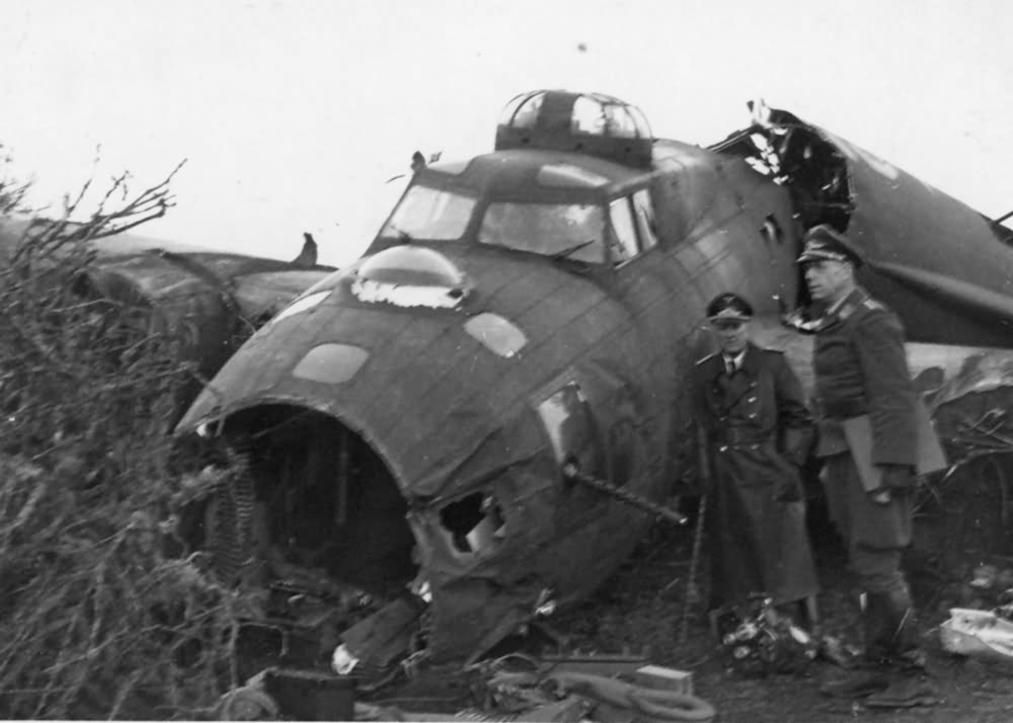 Several Luftwaffe officers inspect a crashed B-17 somewhere in Germany. Between August 1942 and May 8, 1945, Eighth Air Force flew 10,631 missions and lost 4,145 B-17s, each with a 10-man crew. (Archive photo)