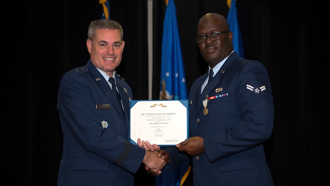 U.S. Air Force Maj. Gen. Lenny Richoux, the Joint Enabling Capabilities Command commander, presents Airman 1st Class PeeJay Jack, a 290th Joint Communications Support Squadron vehicle maintainer, the Airman’s Medal at MacDill Air Force Base, Fla., Feb. 9, 2019. Jack was awarded the Airman’s Medal for saving a motorist after his vehicle lost control, veered of the interstate and burst into flames.