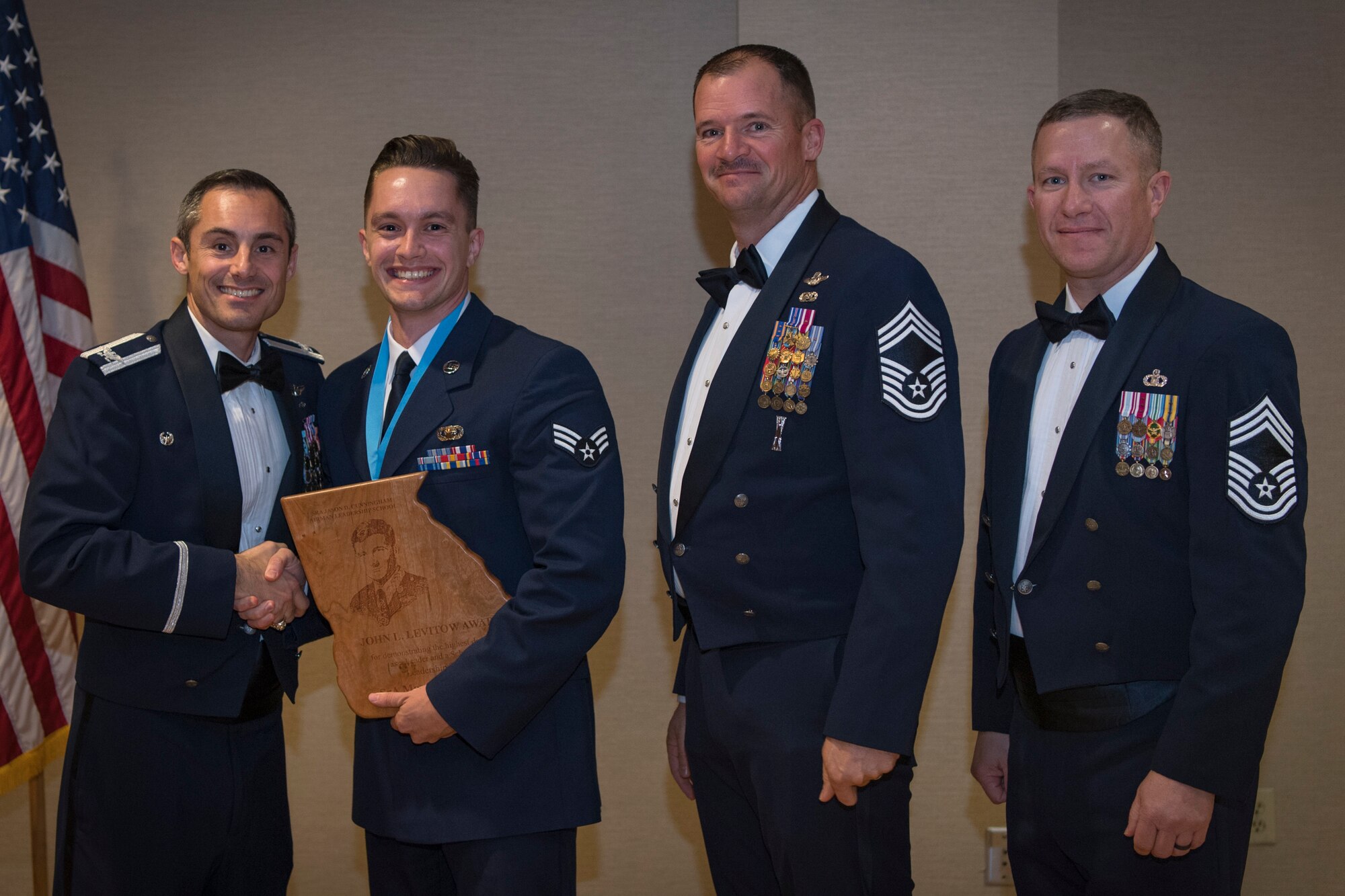 Airmen recieve awards from Airman Leadership School (ALS), Feb. 7, 2019, at Moody Air Force Base, Ga. ALS is a the 5-week course designed to develop Airmen into effective front-line supervisors by focusing on building leadership abilities, teamwork skills and effective communication. (U.S. Air Force photo by Airman Taryn Butler)