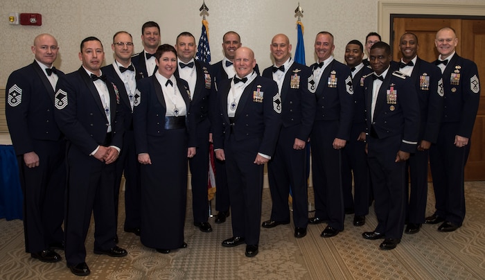The new chief master sergeants and chief master sergeant selects stand with base leadership during an induction ceremony Feb. 9, 2019, at Joint Base Charleston, S.C.