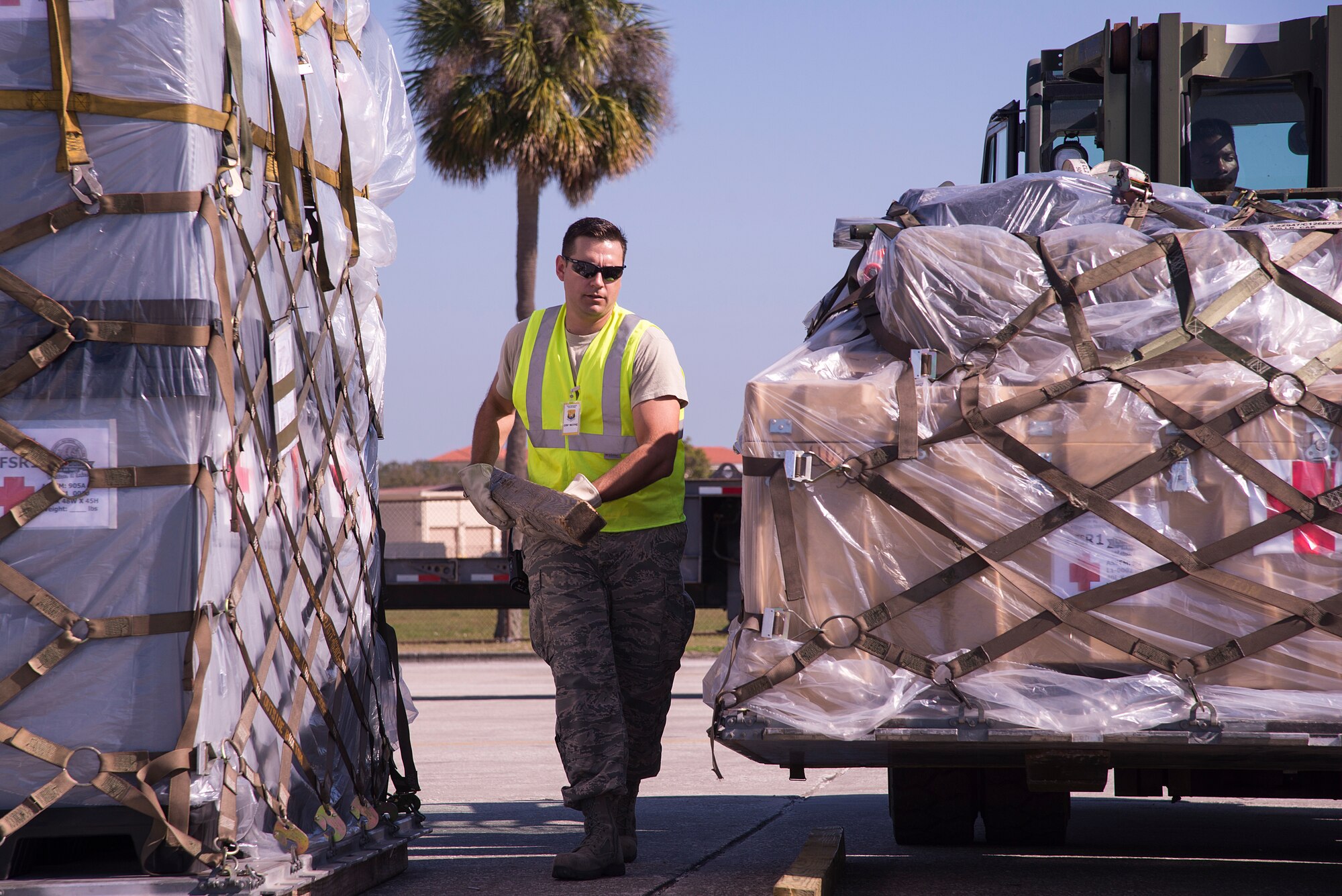 U.S. Air Force Master Sgt. Christopher Kotzur, 6th Logistics Readiness Squadron (LRS) personal property superintendent, moves dunnage under the lifted cargo during an operational readiness exercise Feb. 8, 2019 at MacDill Air Force Base, Fla. Airmen from the 6th LRS ensure cargo is packed safely, weighed and logged before deploying the equipment pallets with their respective units, highlighting the units capability to support contingency operations. (U.S. Air Force photo by Senior Airman Heather Fejerang)