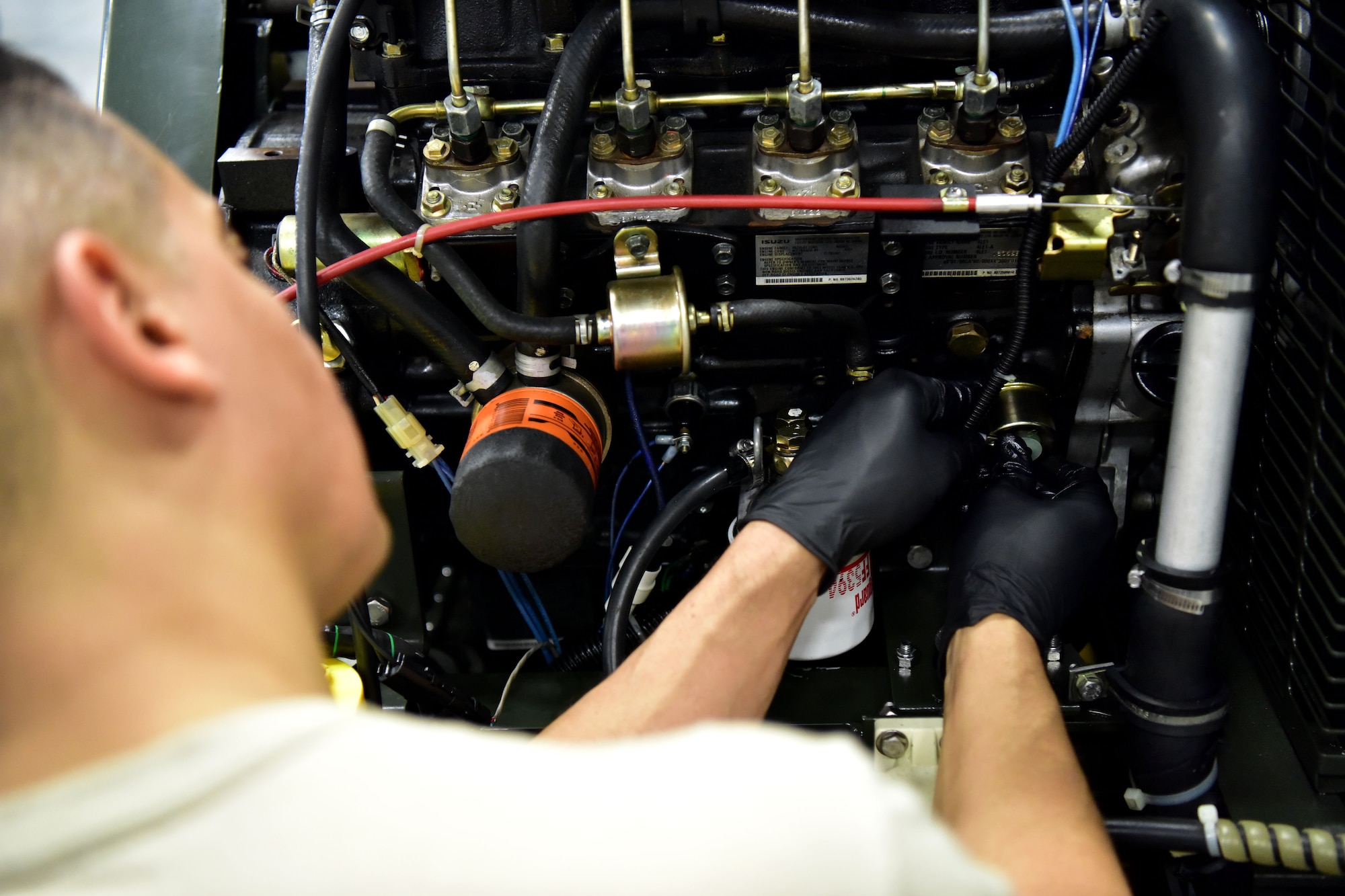 Airman works on a machine.