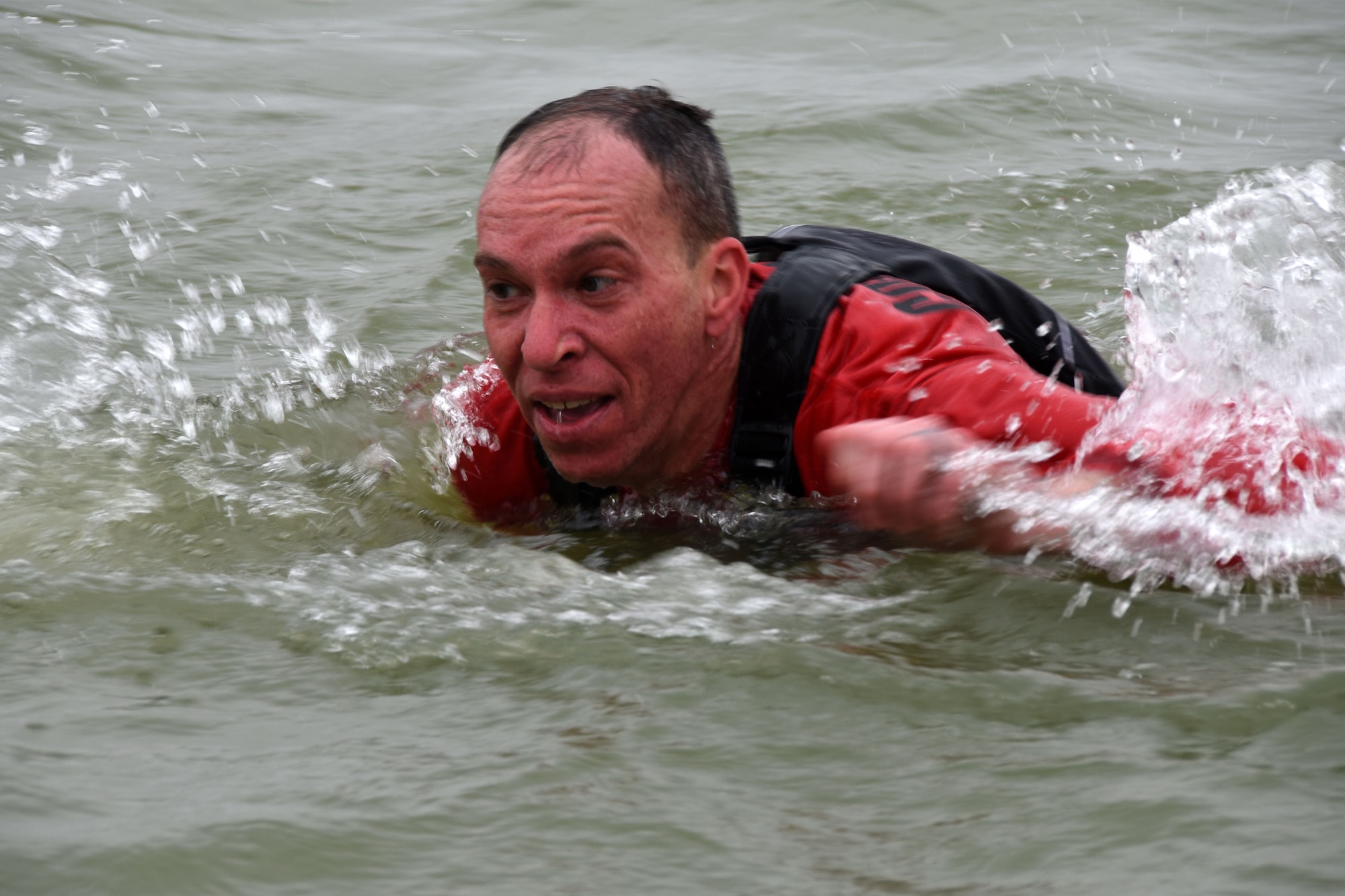 U.S. Air Force Lt. Col. Scott Cline, 312th Training Squadron commander, swims in Lake Nasworthy with his squadron, during the annual Polar Bear Run and Swim at Goodfellow Recreation Camp Feb. 9, 2019. After warming up with a 5K participants could plunge into the 42 degree water with friends. (U.S. Air Force photo by Senior Airman Seraiah Hines/Released)