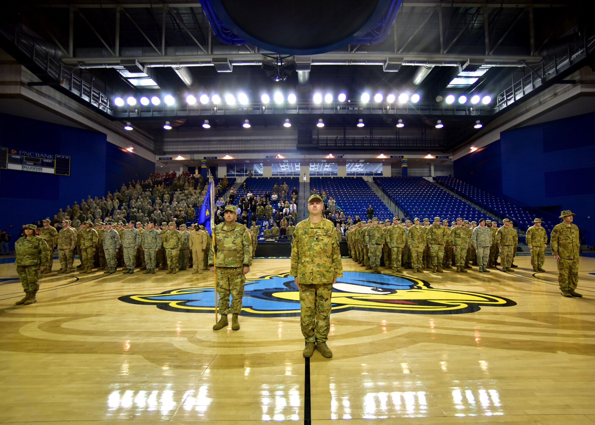 Airmen from the 166th Airlift Wing stand in formation at the University of Delaware’s Bob Carpenter Center in Newark, Del., Feb. 10, 2019. Citizen Airmen from 10 different units in the 166th Airlift Wing were mobilized to multiple areas in Southwest Asia and throughout the globe and returned to Delaware by the end of 2018. (U.S. Air National Guard photo by Senior Airman Katherine Miller)