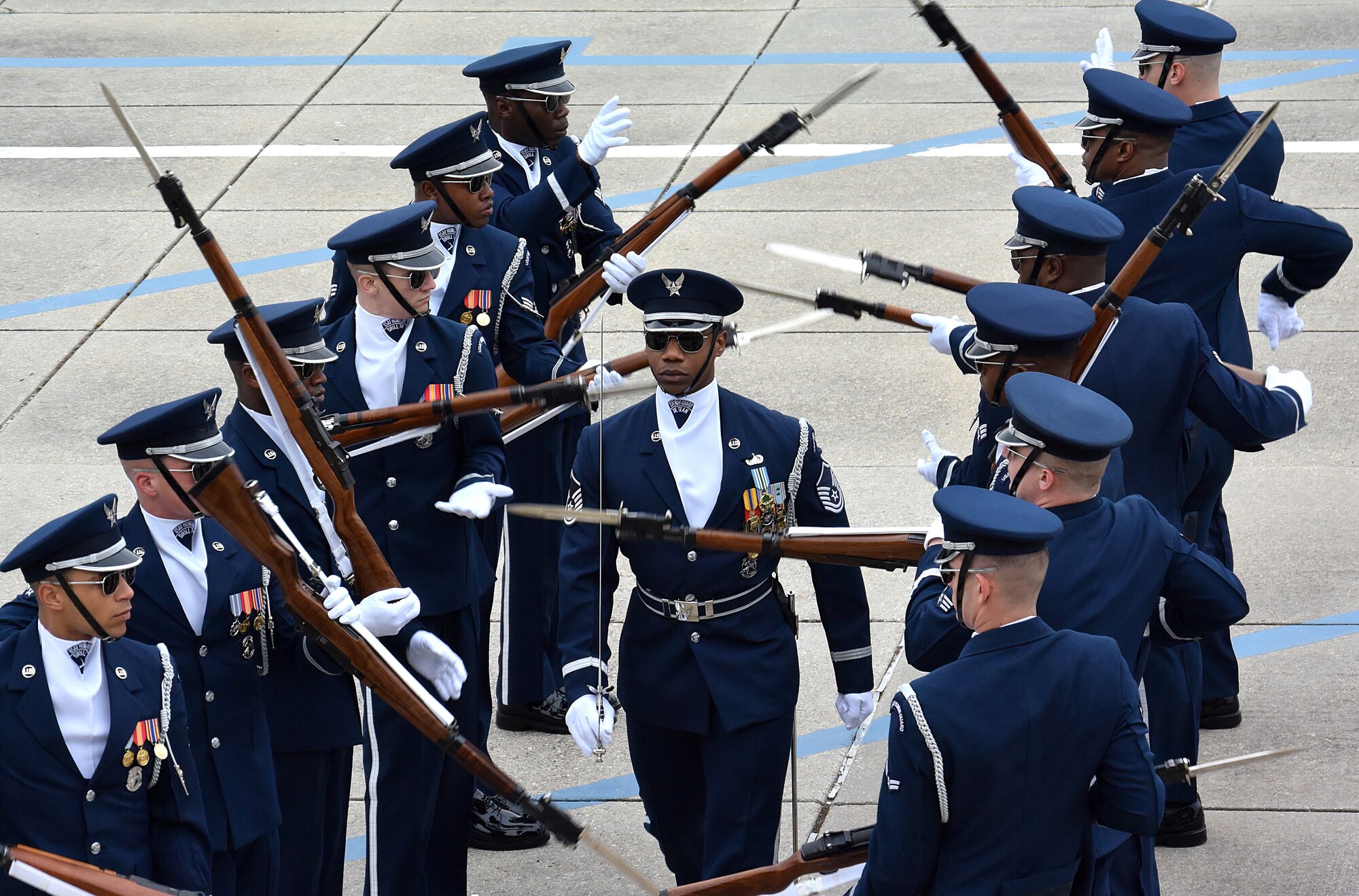 The U.S. Air Force Honor Guard Drill Team debuts their 2019 routine in front of Keesler leadership and 81st Training Group Airmen on the Levitow Training Support Facility drill pad at Keesler Air Force Base, Mississippi, Feb. 8, 2019. They are the nation's most elite honor guard, serving the President of the United States, the Air Force's most senior leaders and performing nationwide for the American public. The team comes to Keesler every year for five weeks to develop a new routine that they will use throughout the year. (U.S. Air Force photo by 2nd Lt. Jantzen Floate)