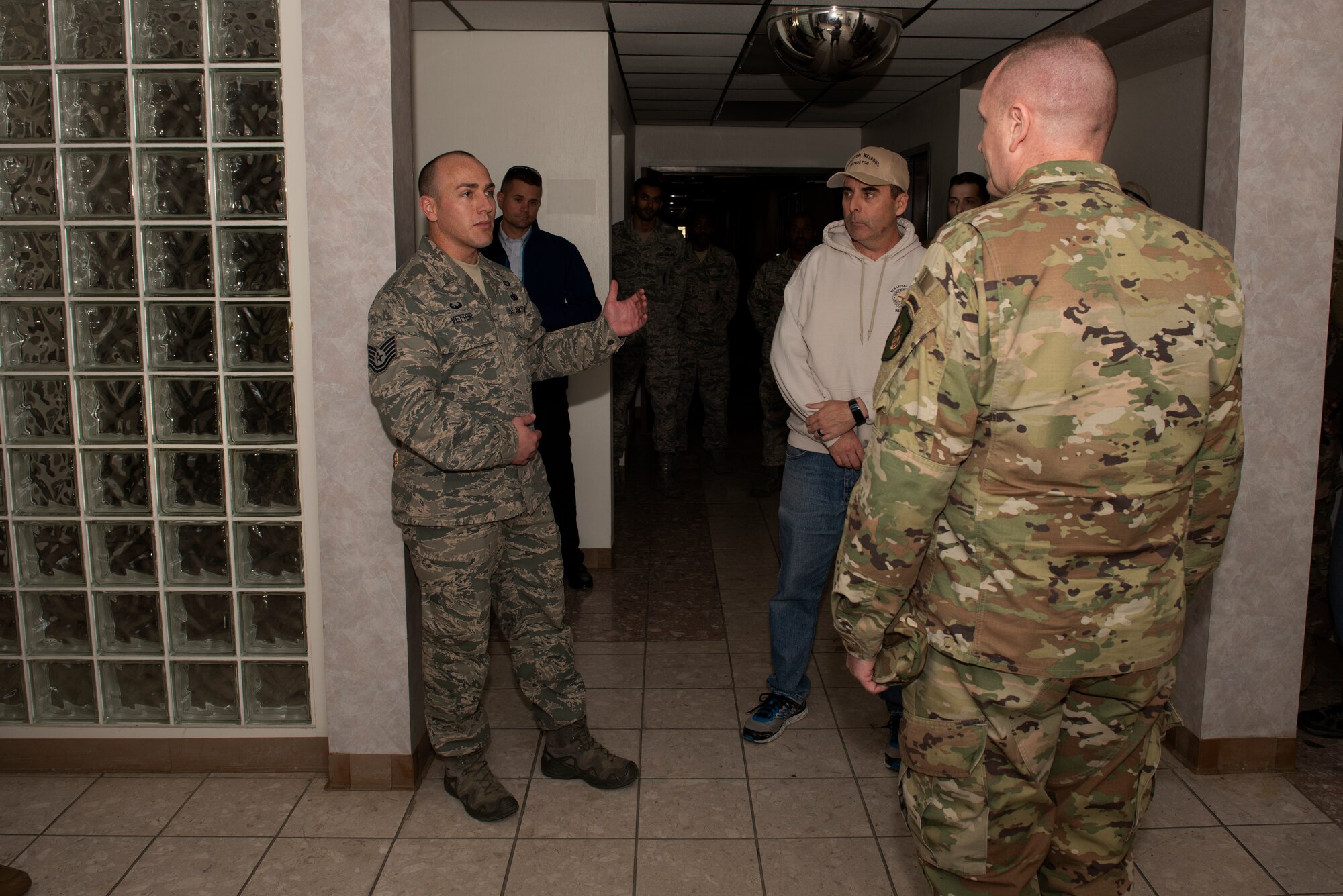 Tech. Sgt. James Vetter (Left), 60th Security Forces Squadron Raven program manager, discusses security forces training with Chief Master Sgt. Jason France, U.S. Transportation Command Senior Enlisted Leader, Feb. 7, 2019 during a visit at Travis Air Force Base, Calif. During his visit, France observed security forces training, toured the installation and met with senior leaders. (U.S. Air Force photo by Tech. Sgt. James Hodgman)
