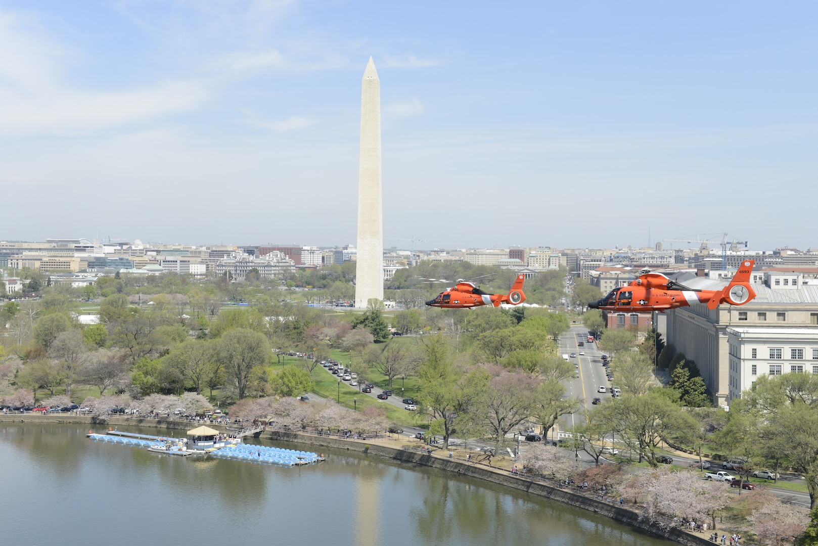 An MH-65 Dolphin helicopter crew from Coast Guard Air Station Atlantic City, N.J., flies over Washington on a training flight Thursday, April 16, 2015. Aircrews from Coast Guard Air Station Atlantic City train to stay proficient for the Rotary Wing Air Intercept mission over the nation’s capital and other critical areas throughout the country. (U.S. Coast Guard photo by Petty Officer 3rd Class David Micallef)