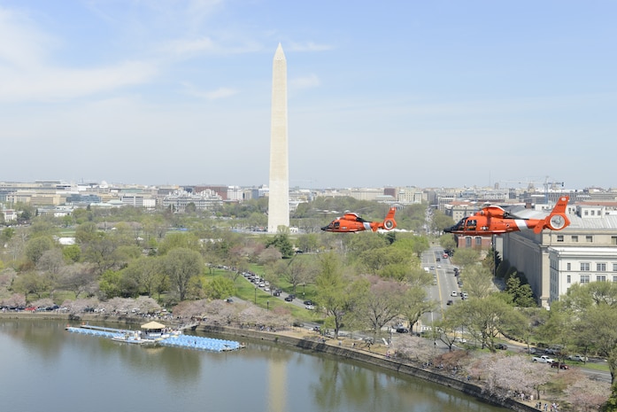 An MH-65 Dolphin helicopter crew from Coast Guard Air Station Atlantic City, N.J., flies over Washington on a training flight Thursday, April 16, 2015. Aircrews from Coast Guard Air Station Atlantic City train to stay proficient for the Rotary Wing Air Intercept mission over the nation’s capital and other critical areas throughout the country. (U.S. Coast Guard photo by Petty Officer 3rd Class David Micallef)