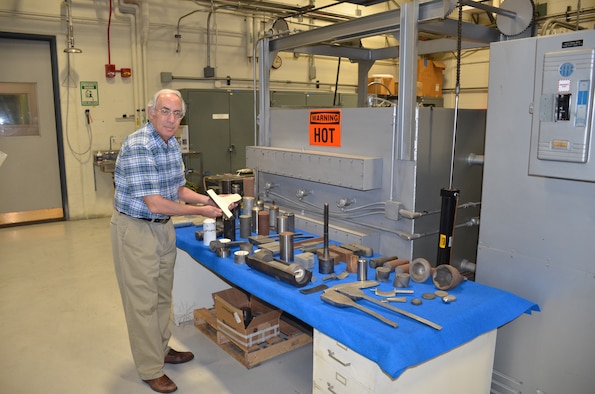 The Air Force Research Laboratory’s Dr. Sheldon (Lee) Semiatin handles metal samples in the Experimental Materials Processing Laboratory. It serves as both a state-of-the-art laboratory for basic and applied research as well as a test bed for new materials and processes developed in conjunction with partners in the Air Force supply chain.(U.S. Air Force photo/Donna Lindner)