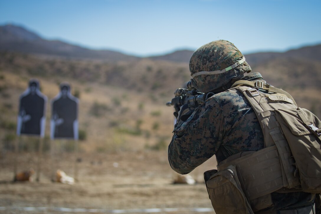 U.S. Marine Corps Lance Cpl. Everett Libolt, a missile gunner with 1st Tank Battalion, fires a M16 rifle during the live fire portion of the 1st Marine Division (MARDIV) Super Squad Competition at Marine Corps Base Camp Pendleton, California, Aug. 30, 2018.