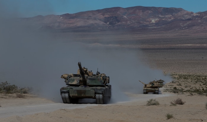 U.S. Marines with 1st Tank Battalion, move to their combat operation center, during exercise Steel Knight (SK) 2019 at Marine Corps Air Ground Combat Center, Twentynine Palms, California, Dec. 4, 2018.
