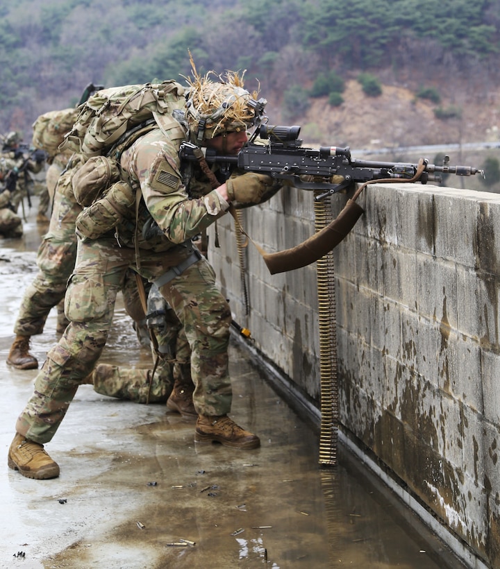 Soldiers use suppressing fire during a force-on-force exercise.